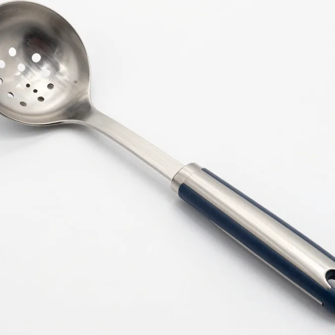 Editorial product photography of a stainless steel kitchen tool o